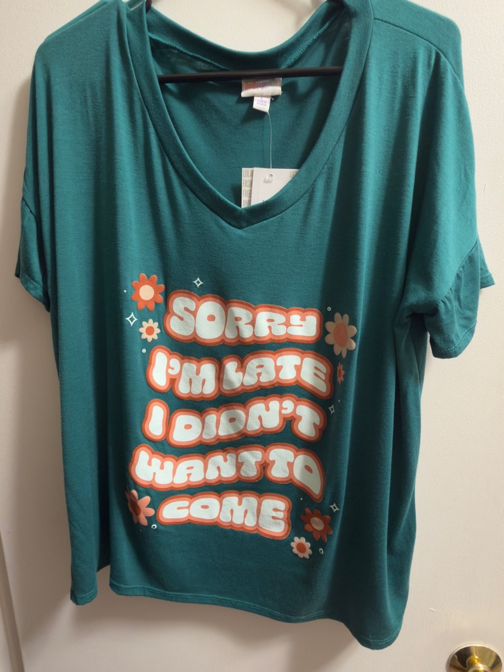 LuLaRoe Teal V-Neck Tee with Orange & White Retro Graphic
